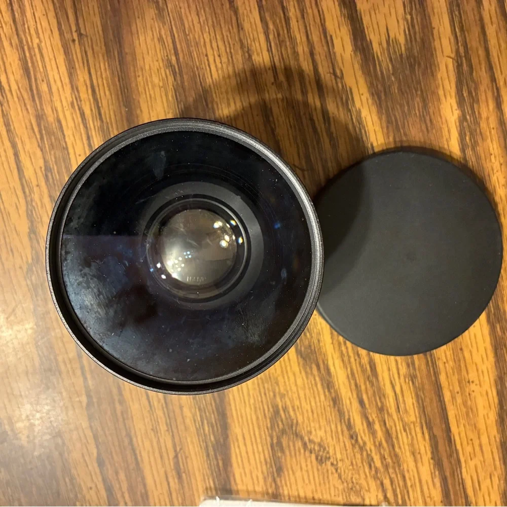 MC 2X teleconverter lens with its case and accessories.